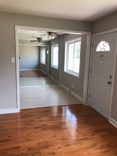 5204 State Road Burbank, IL 60459 - Photo 5 of 30 an empty room with wooden floor and windows