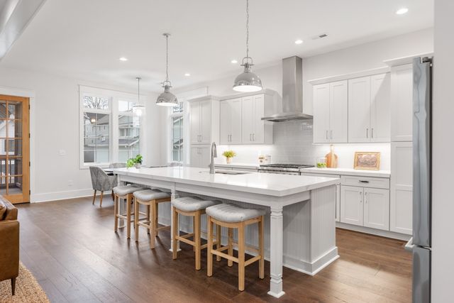 a bedroom with a bed wooden floor and a window