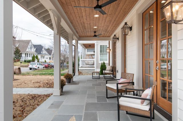 a dining room with wooden floor and large window