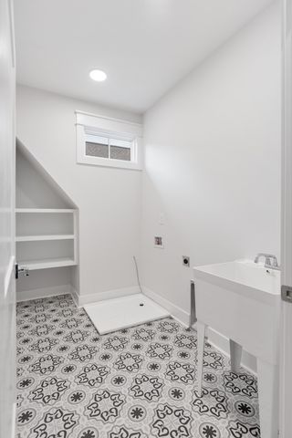 a kitchen with a sink stove and microwave