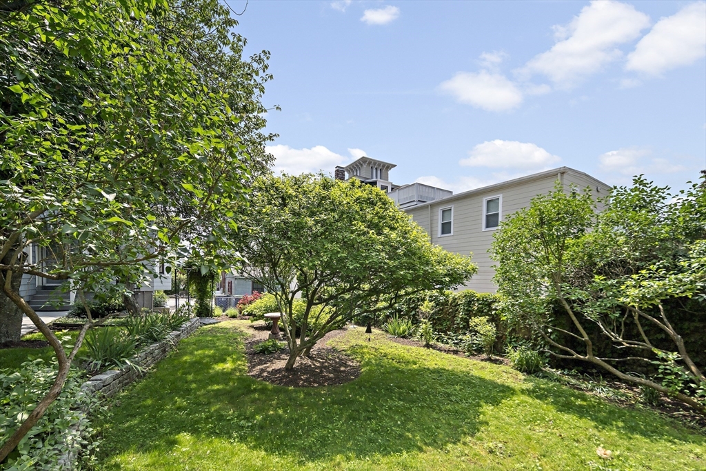 38 Spring Street, Unit 3 Somerville, MA 02143 - Photo 13 of 19 a view of a yard in front of a house