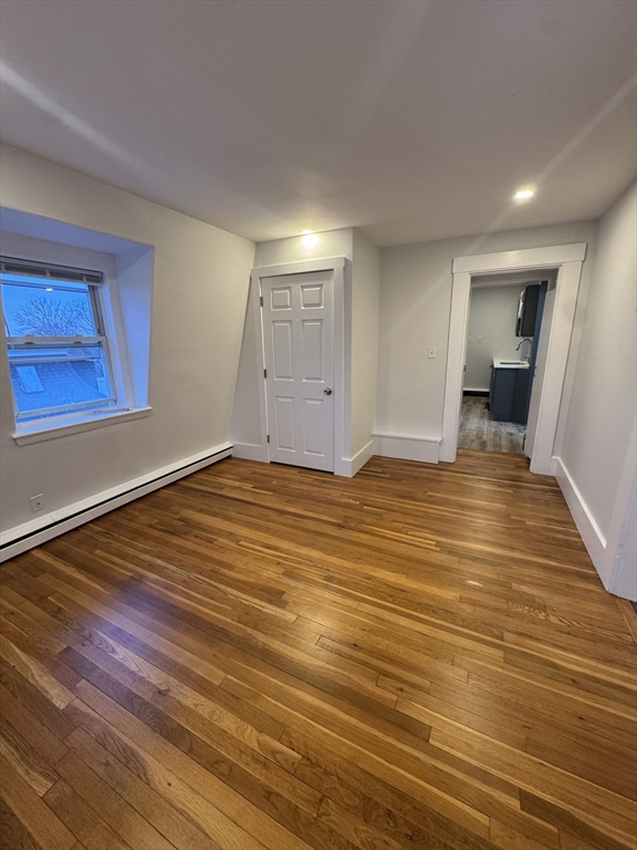 38 Spring Street, Unit 3 Somerville, MA 02143 - Photo 3 of 19 a view of a room with wooden floor