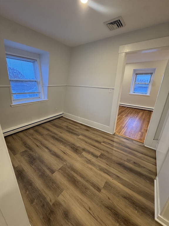 38 Spring Street, Unit 3 Somerville, MA 02143 - Photo 8 of 19 a view of a room with wooden floor