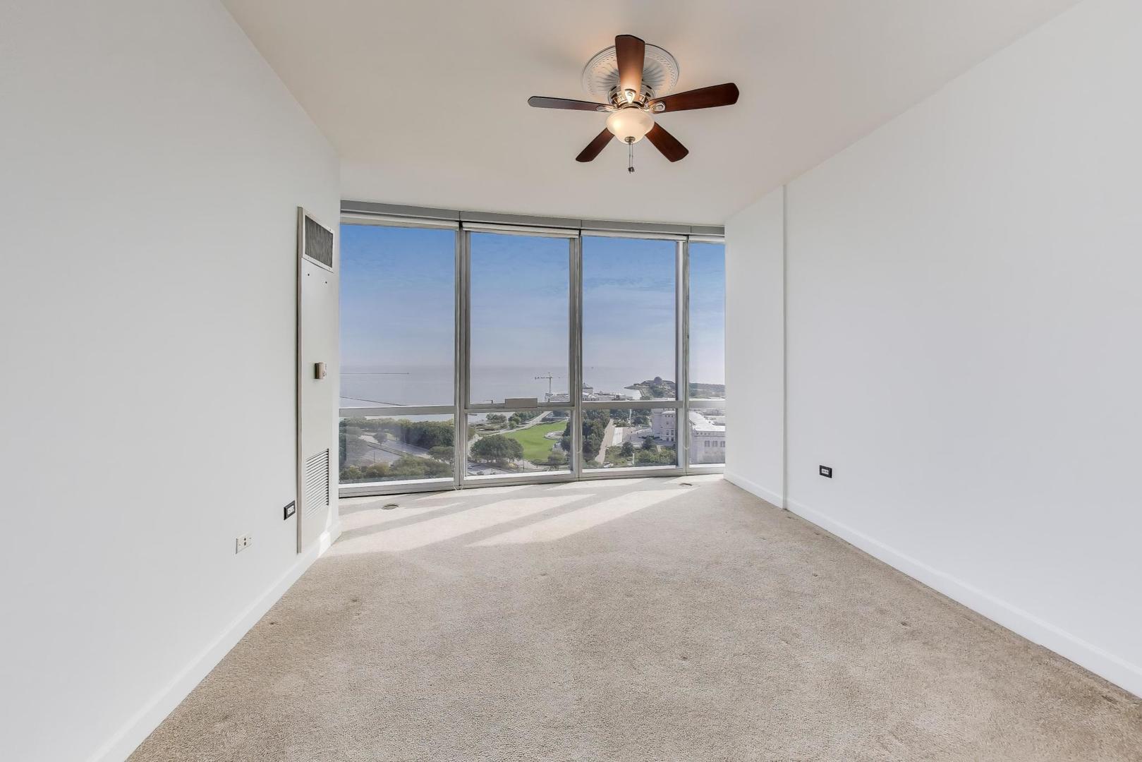 1211 South Prairie Avenue, Unit 2003 Chicago, IL 60605 - Photo 11 of 40 an empty room with fan