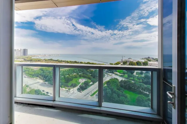 a view of kitchen with cabinets and outdoor space