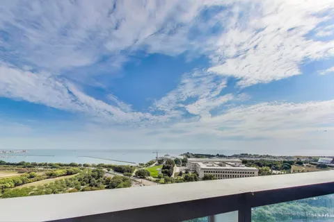 a picture of a bathroom with a shower and a mirror