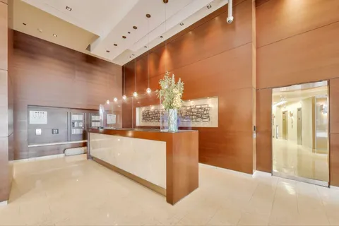 a large white kitchen with a large window