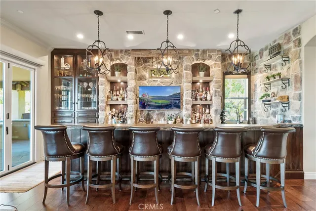 a living room with furniture a window and a flat screen tv