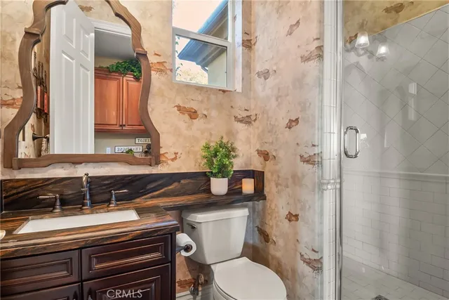 a view of a terrace with a table and chairs