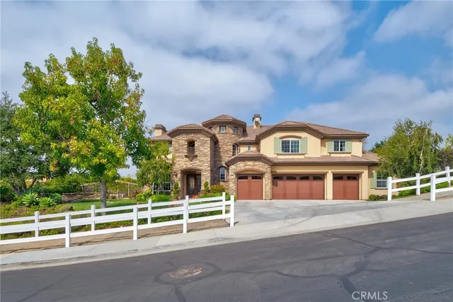 front view of a house with a garden