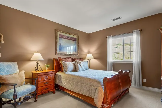 a spacious bathroom with a tub sink and mirror