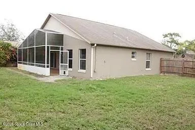 a backyard of a house with lots of green space