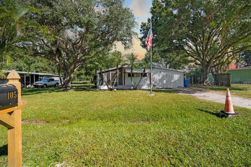 105 Domino Drive North Ruskin, FL 33570 - Photo 1 of 12 a view of a house with a yard