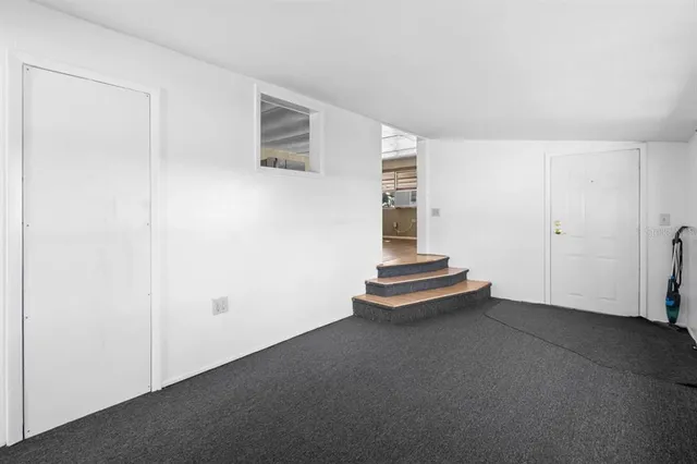 an empty room with staircase