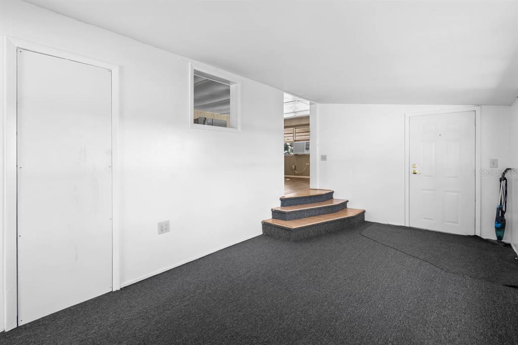 105 Domino Drive North Ruskin, FL 33570 - Photo 9 of 12 an empty room with staircase