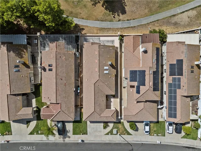 a front view of a building with outdoor seating