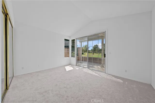 an empty room with glass door