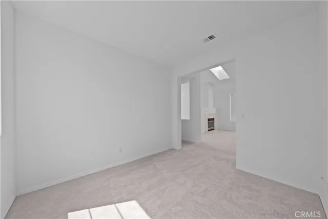 a view of a patio with a table chairs and iron fence