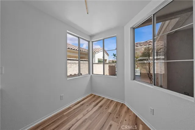 an aerial view of a house with a street