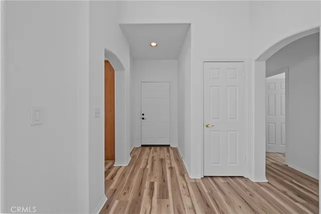 a view of a room with wooden floor