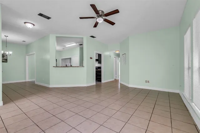 a view of a kitchen with a sink and a refrigerator