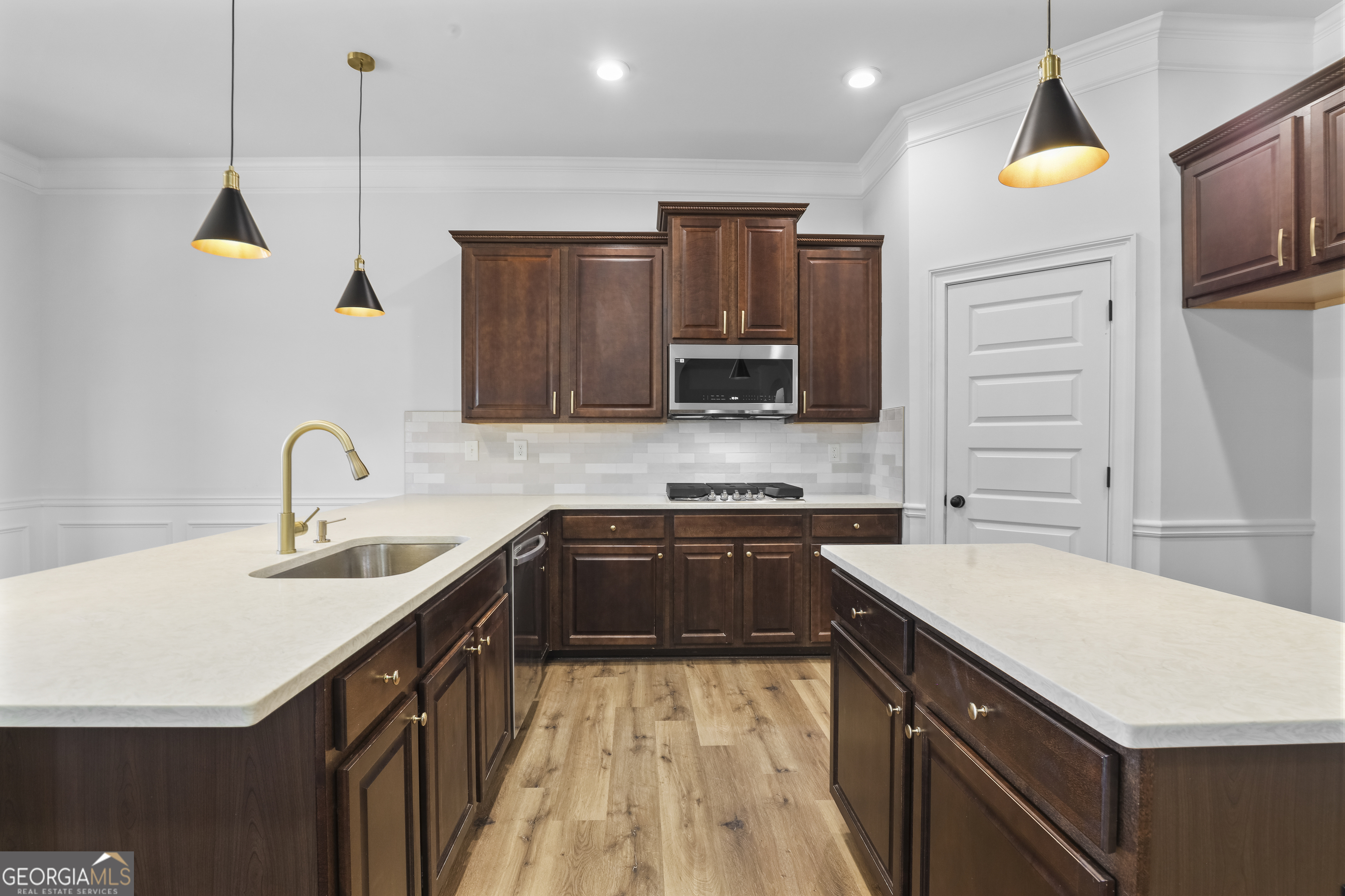200 Snow Bird Drive Hampton, GA 30228 - Photo 13 of 55 a kitchen with a sink a stove and cabinets