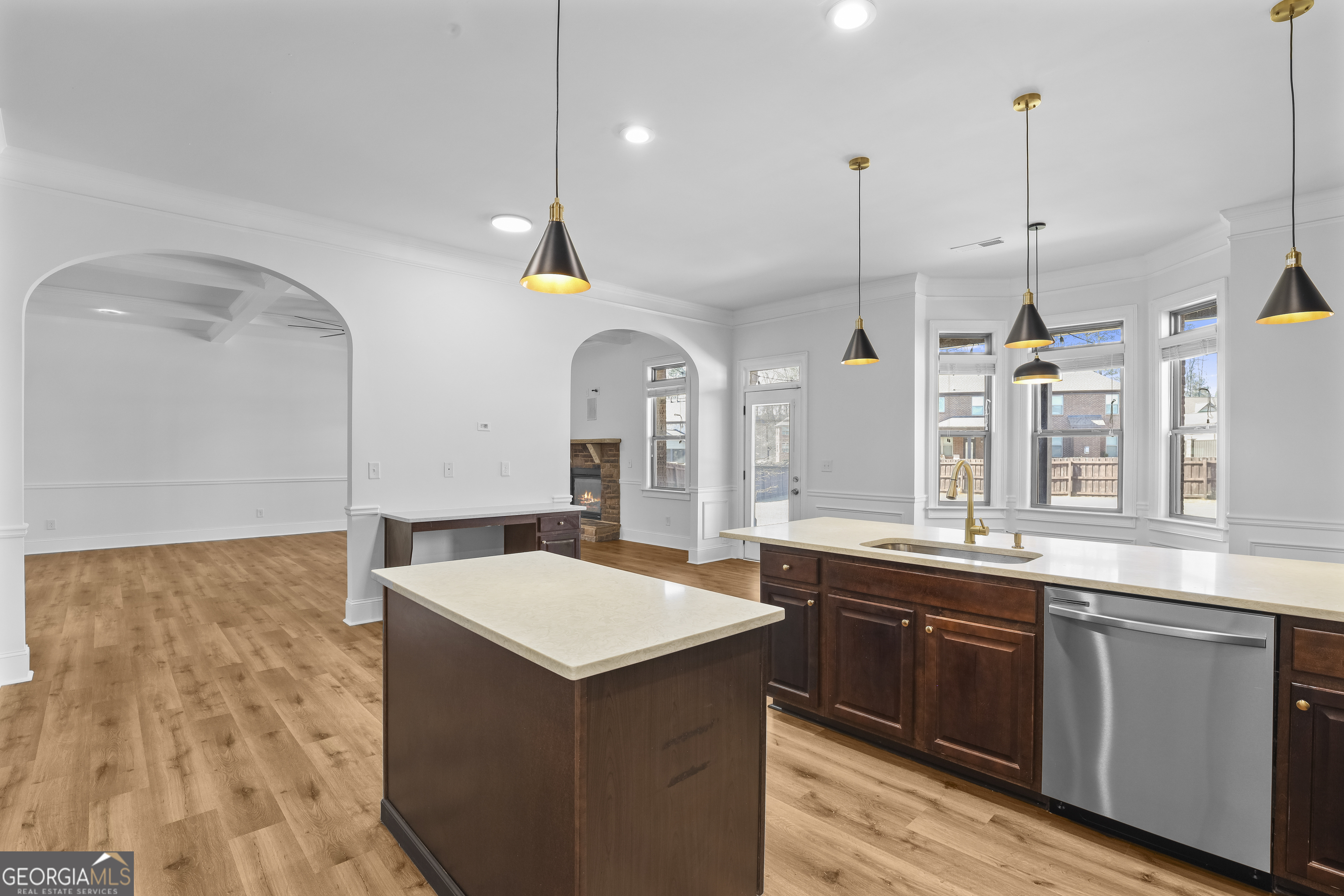 200 Snow Bird Drive Hampton, GA 30228 - Photo 14 of 55 a large kitchen with a sink a center island and stainless steel appliances