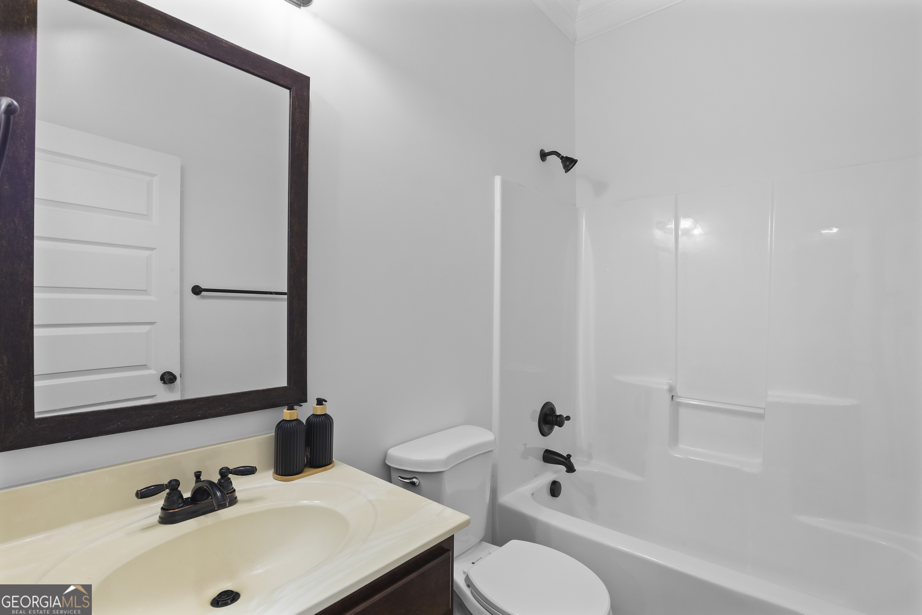 200 Snow Bird Drive Hampton, GA 30228 - Photo 18 of 55 a bathroom with a sink toilet and shower