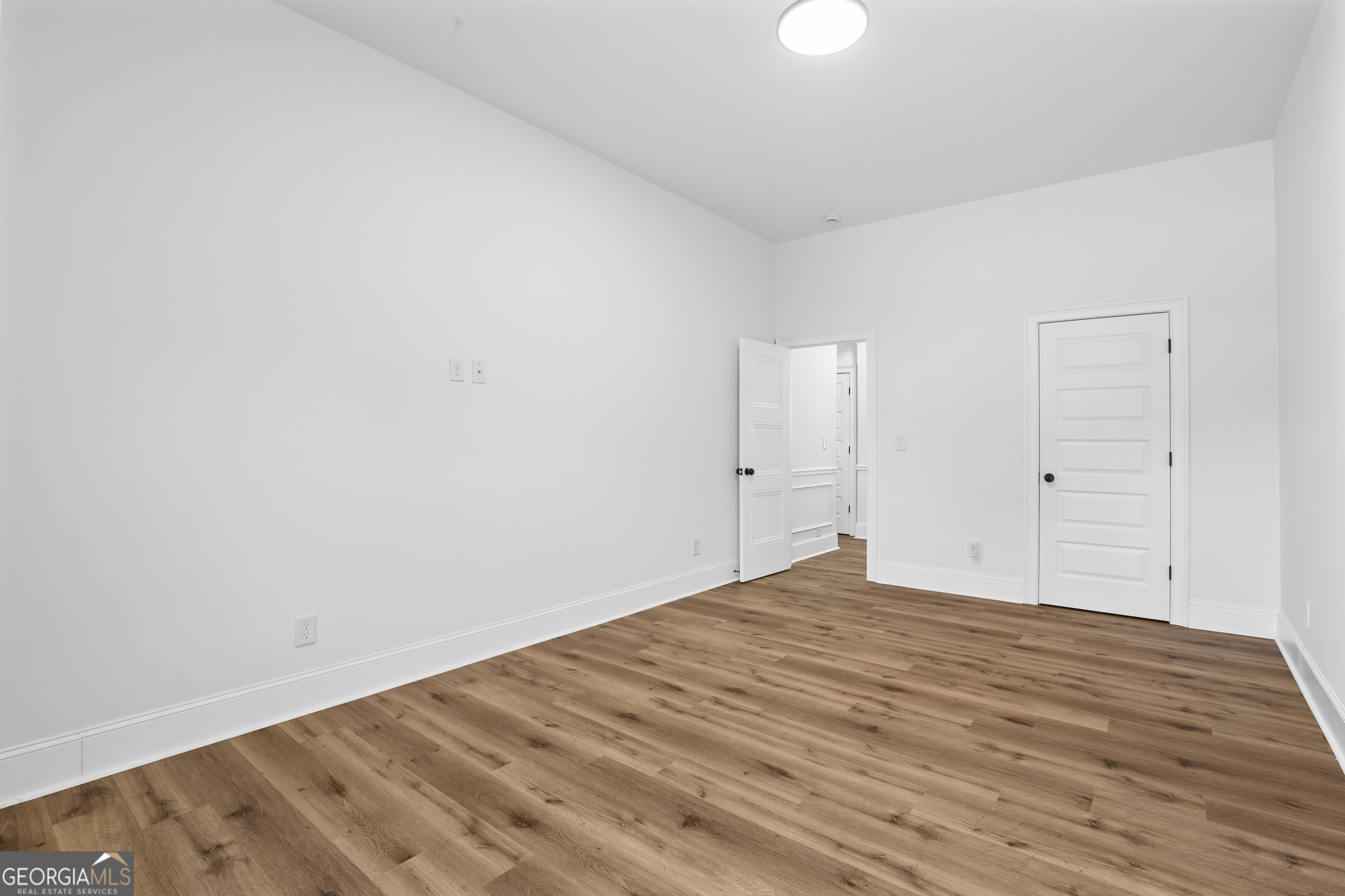 200 Snow Bird Drive Hampton, GA 30228 - Photo 20 of 55 a view of empty room with wooden floor
