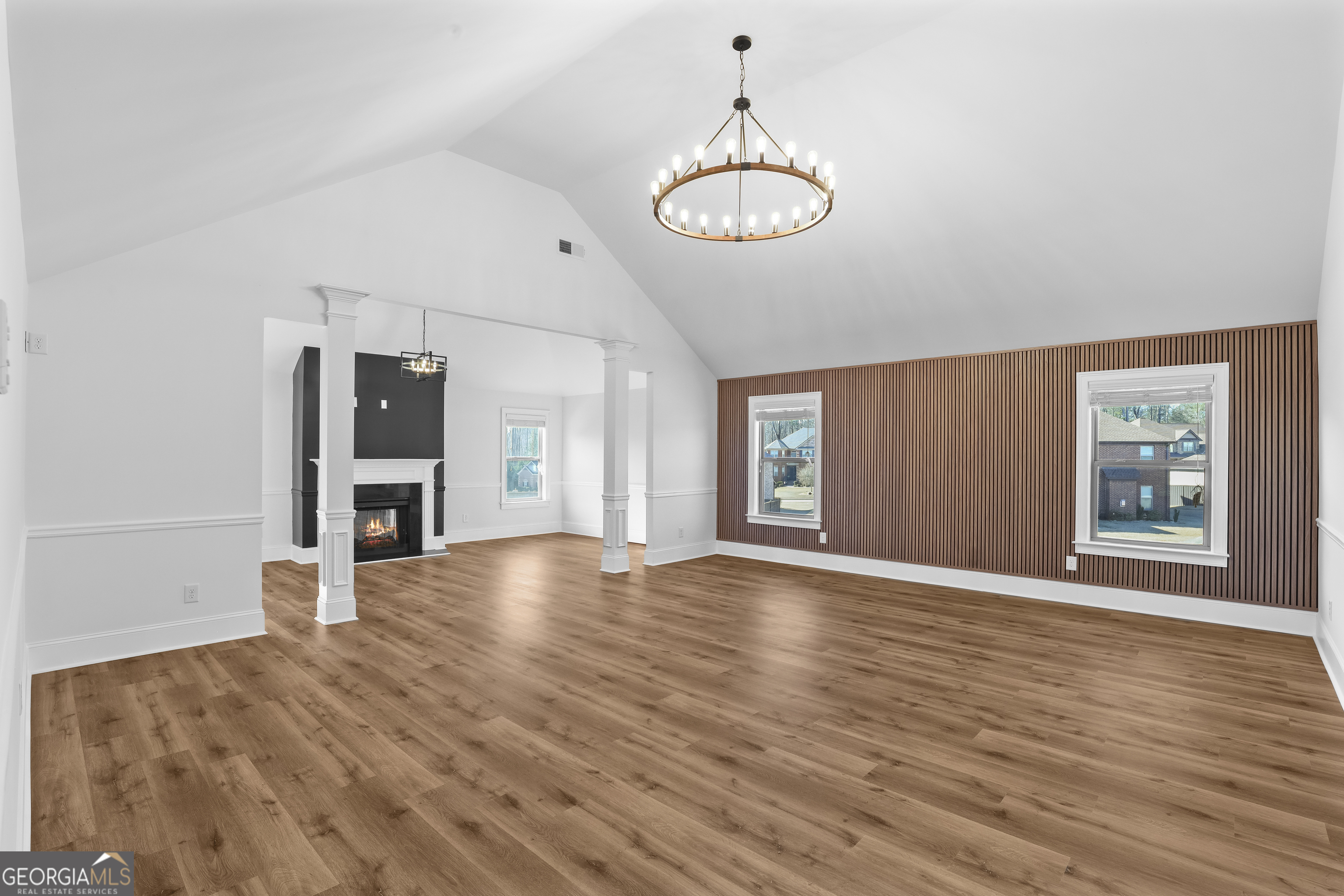 200 Snow Bird Drive Hampton, GA 30228 - Photo 2 of 55 a view of an empty room with window and wooden floor