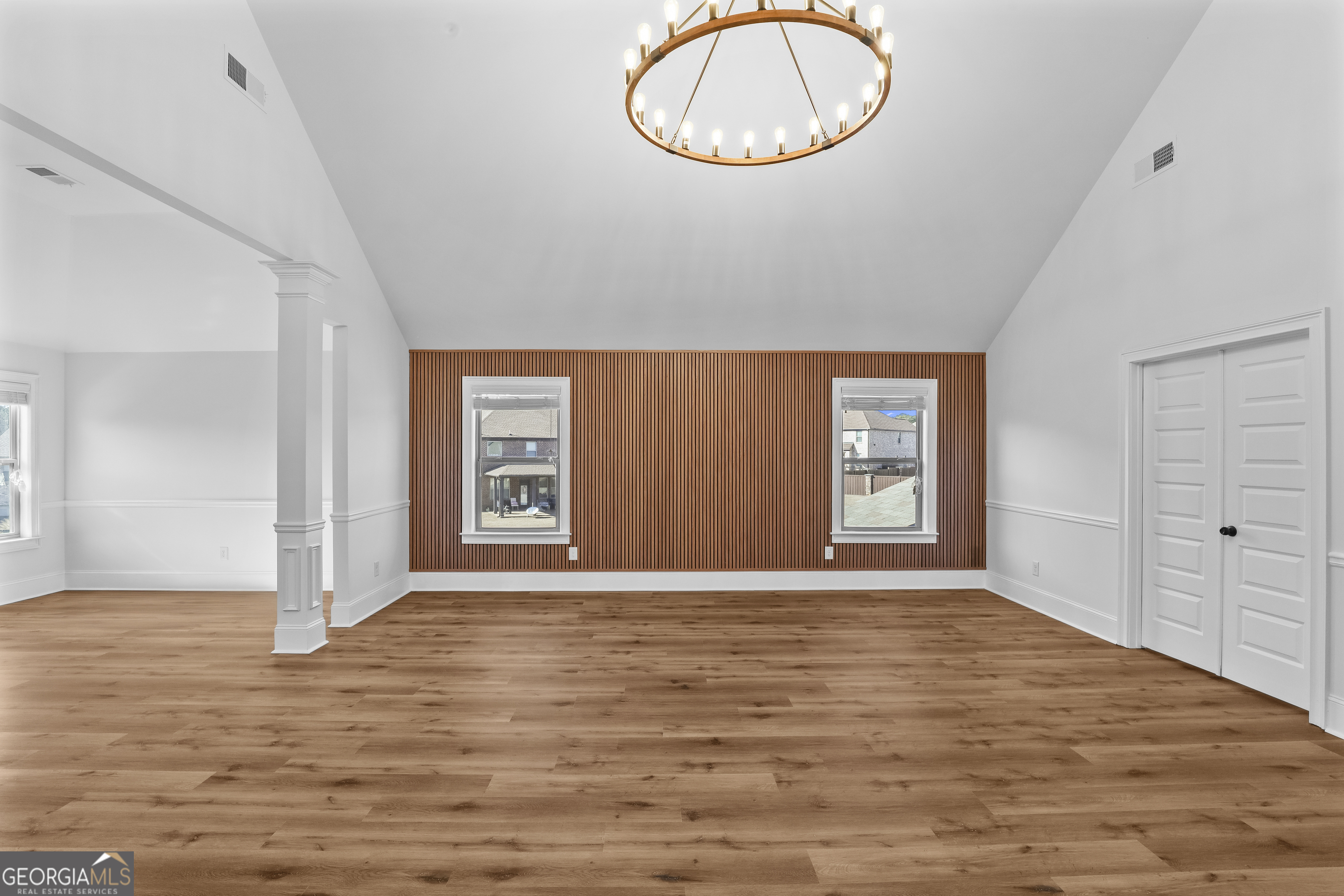200 Snow Bird Drive Hampton, GA 30228 - Photo 25 of 55 a view of an empty room with window and wooden floor