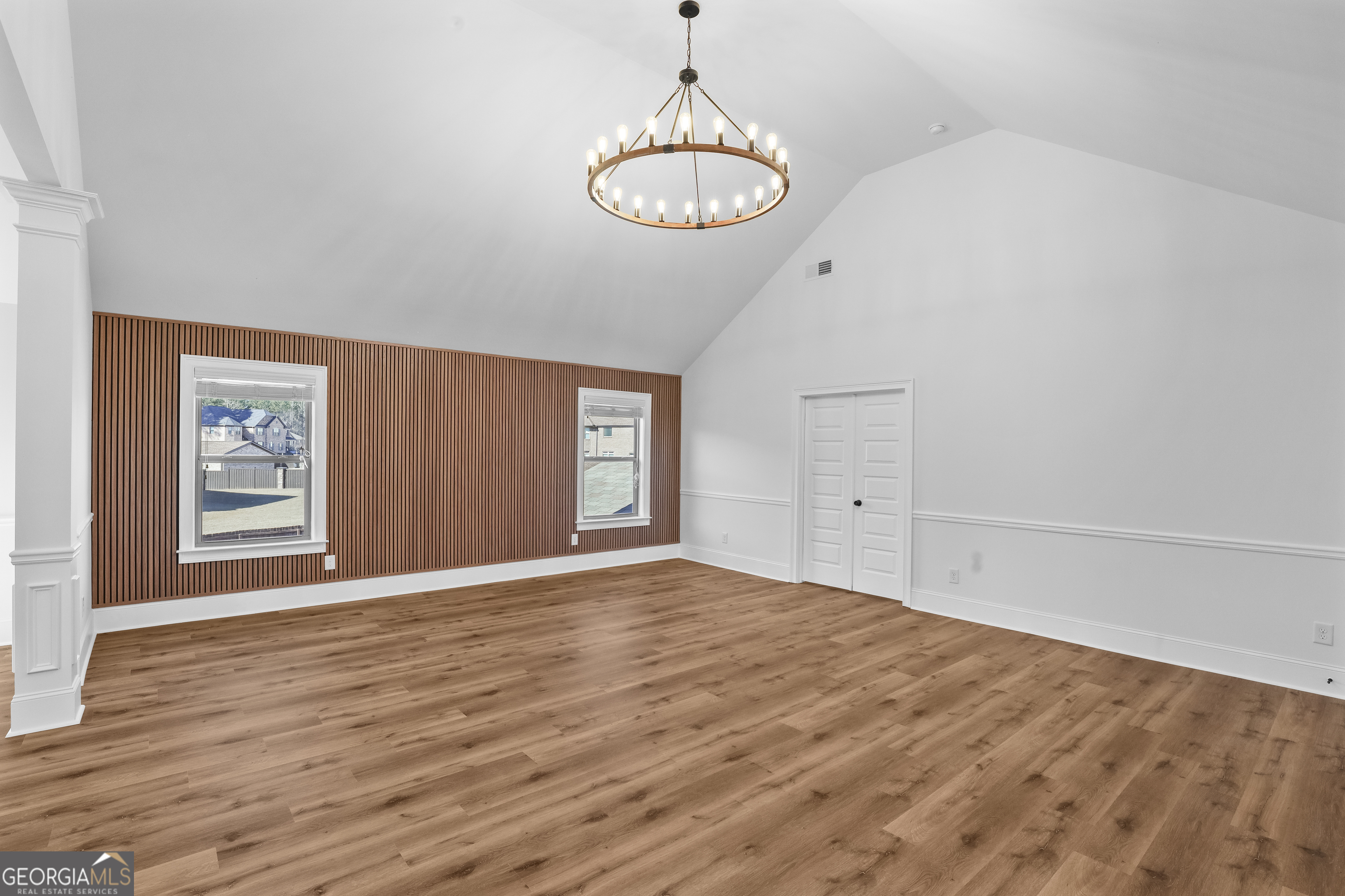 200 Snow Bird Drive Hampton, GA 30228 - Photo 3 of 55 a view of an empty room with window and wooden floor