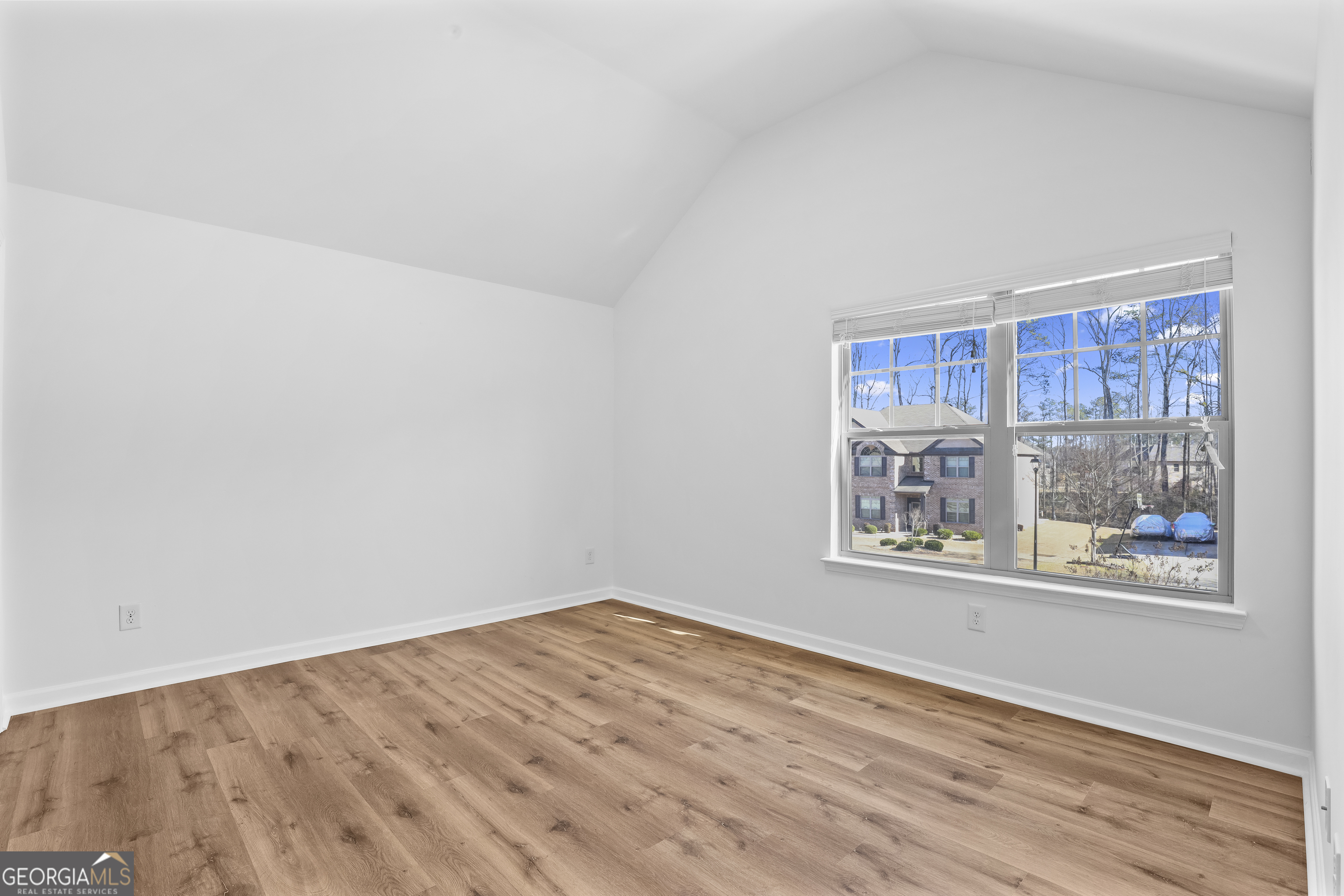 200 Snow Bird Drive Hampton, GA 30228 - Photo 35 of 55 a view of empty room with wooden floor and fan