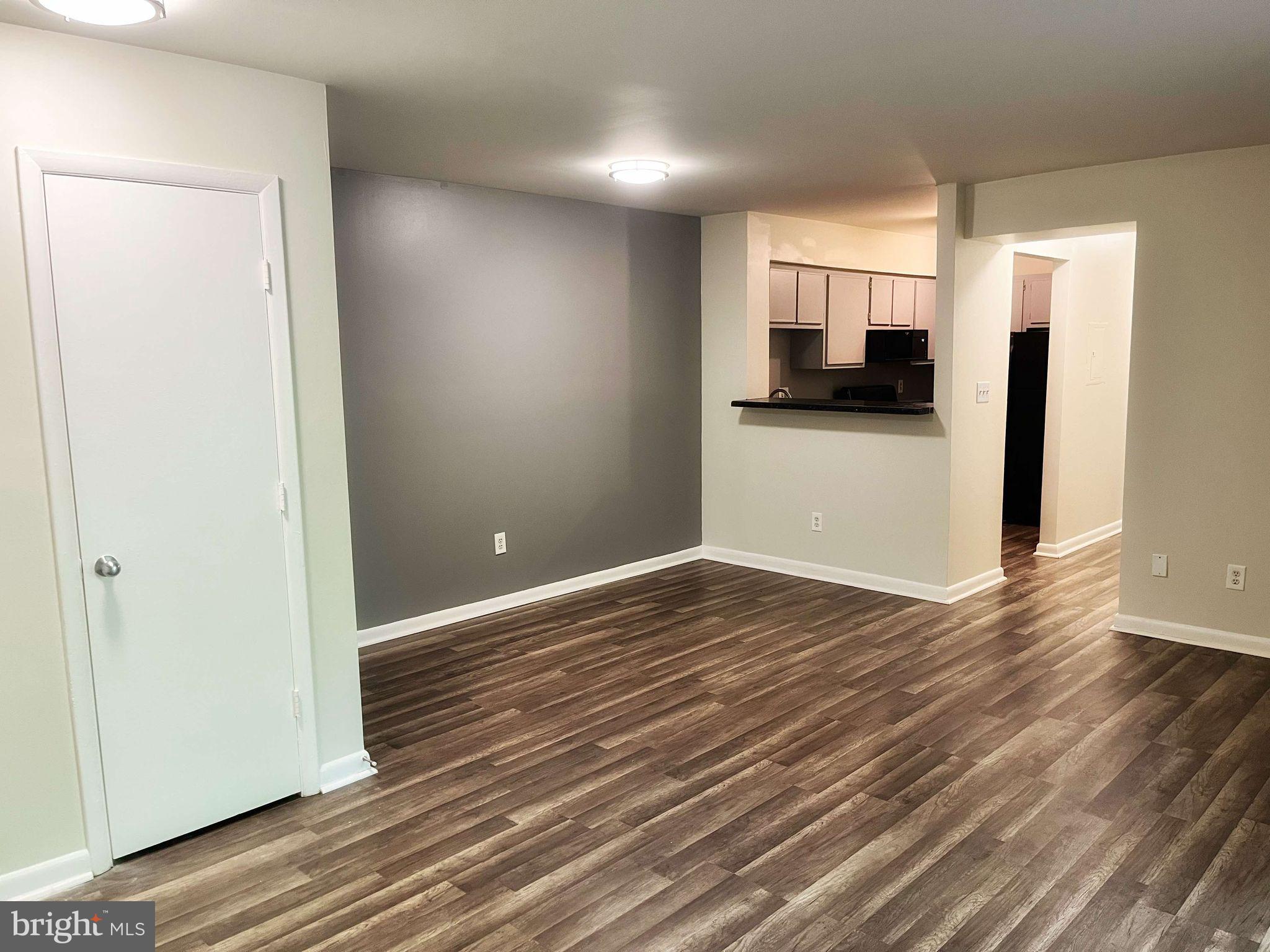 2656 Bowen Road Southeast, Unit 402 Washington, DC 20020 - Photo 2 of 18 Living room and kitchen