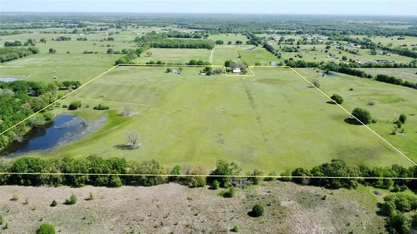 an aerial view of houses with outdoor space