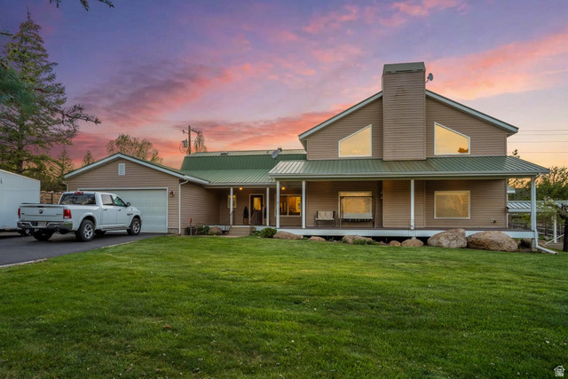 48 South Sage Road Pine Valley, UT 84781 - Photo 2 of 61 Spacious residence featuring a metal roof, attached garage, and a covered front porch