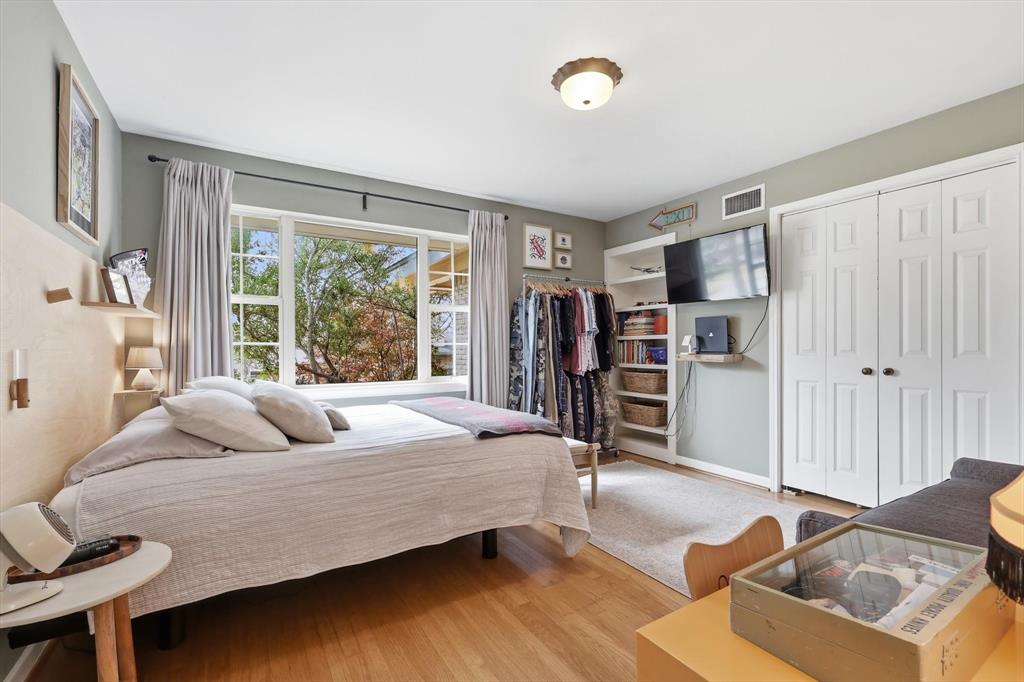 10029 Shadyview Drive Dallas, TX 75238 - Photo 16 of 30 a bedroom with a bed and a large window