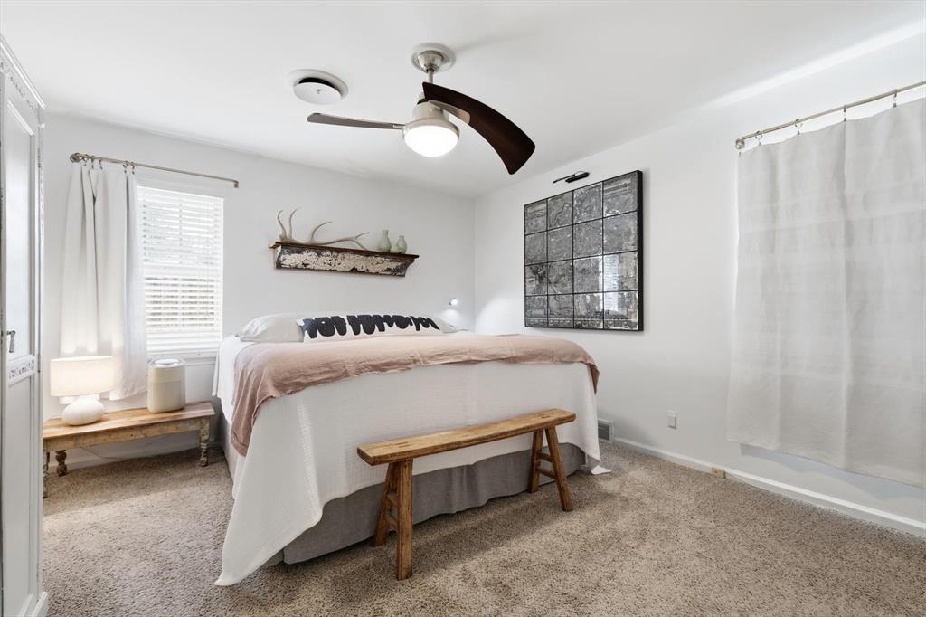 10029 Shadyview Drive Dallas, TX 75238 - Photo 19 of 30 a bed room with a bed and a window