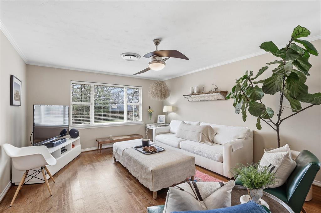 10029 Shadyview Drive Dallas, TX 75238 - Photo 2 of 30 a living room with furniture or couch and a potted plant