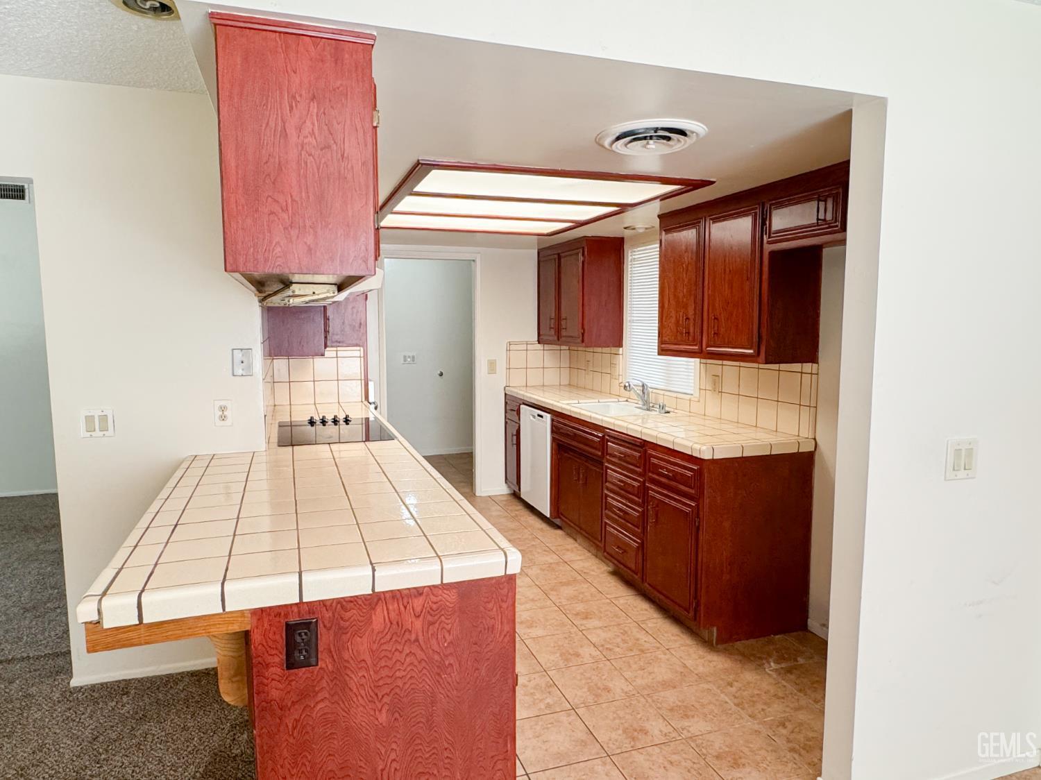 Undisclosed Address Bakersfield, CA 93309 - Photo 12 of 38 a spacious bathroom with a sink and a mirror