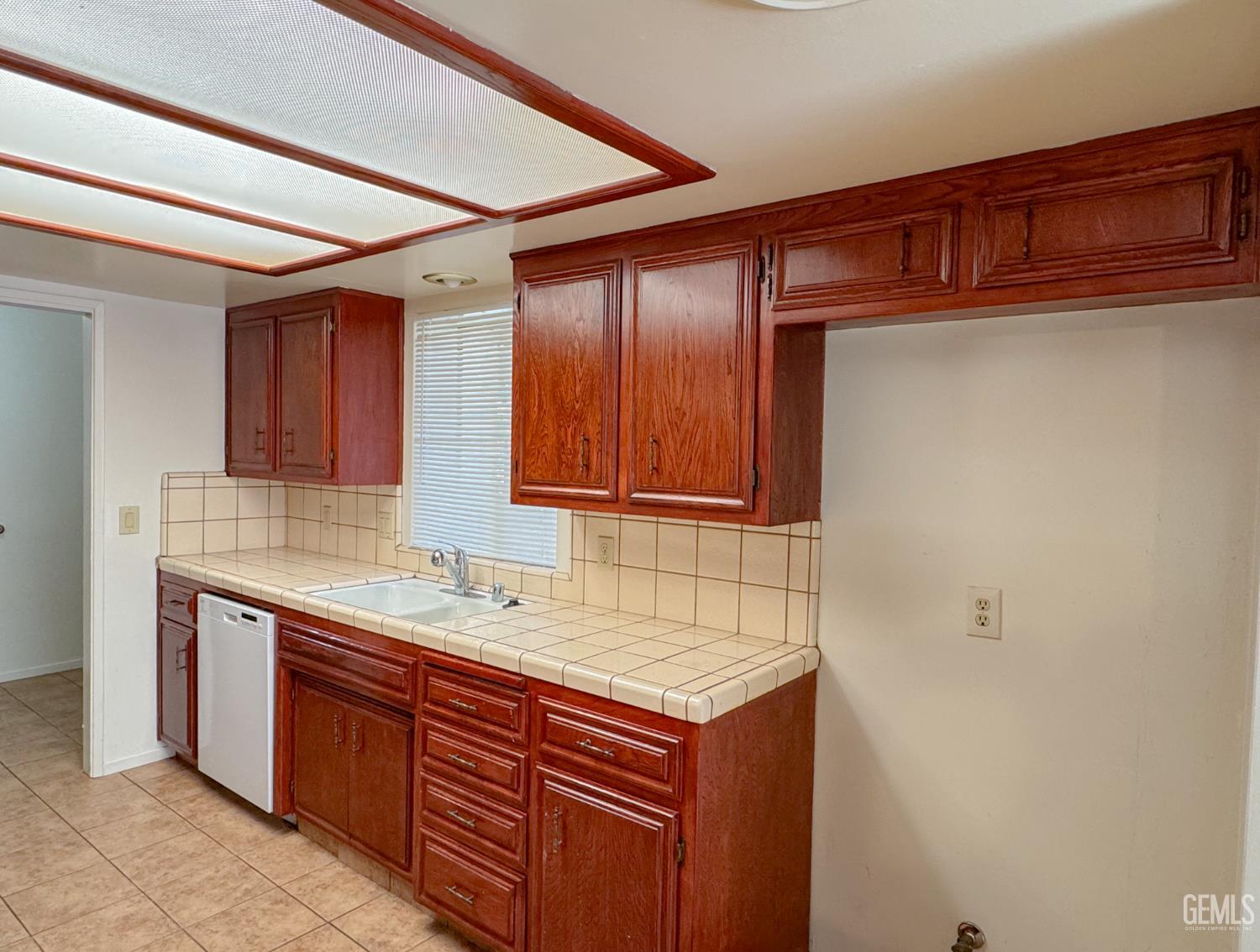 Undisclosed Address Bakersfield, CA 93309 - Photo 13 of 38 a bathroom with a sink and a mirror