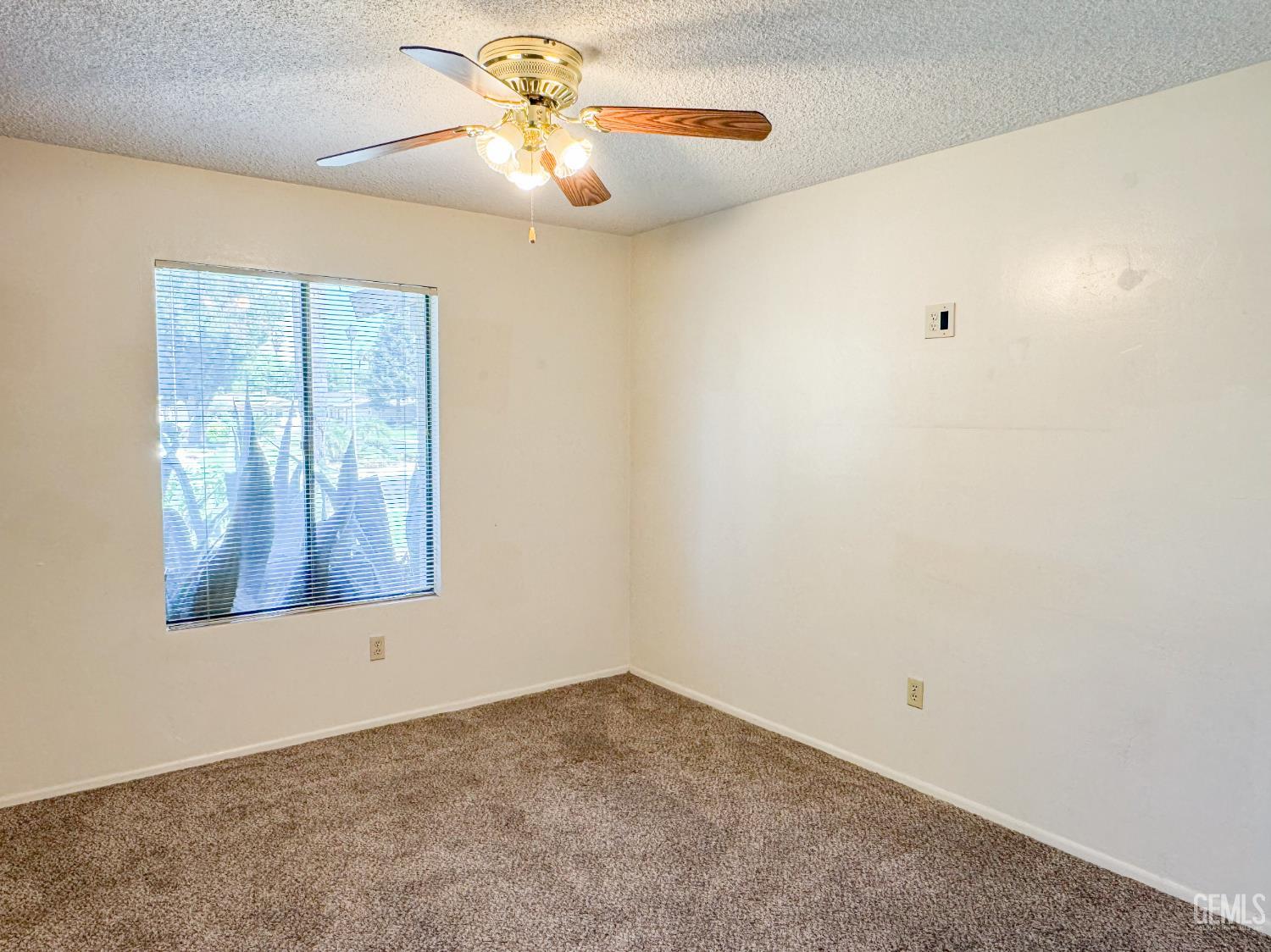 Undisclosed Address Bakersfield, CA 93309 - Photo 17 of 38 an empty room with a window