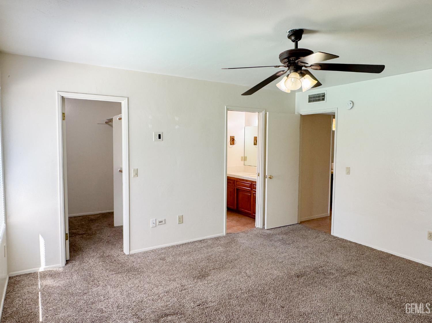 Undisclosed Address Bakersfield, CA 93309 - Photo 24 of 38 a view of a room with a ceiling fan and entryway