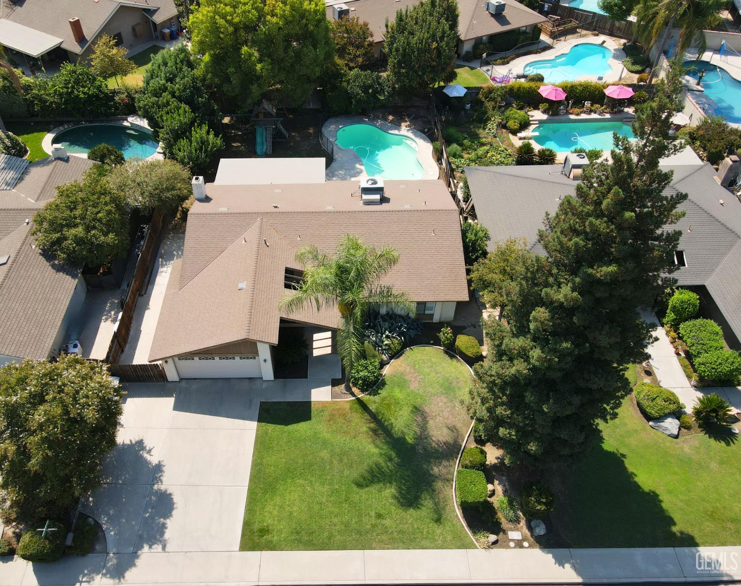 Undisclosed Address Bakersfield, CA 93309 - Photo 3 of 38 a view of a swimming pool with a yard