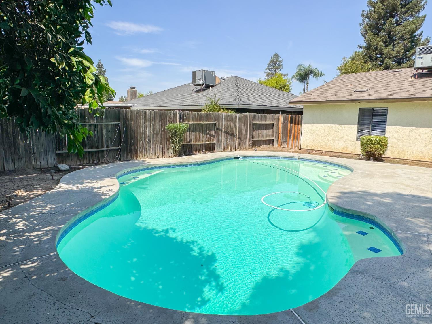 Undisclosed Address Bakersfield, CA 93309 - Photo 33 of 38 a view of a house with a swimming pool