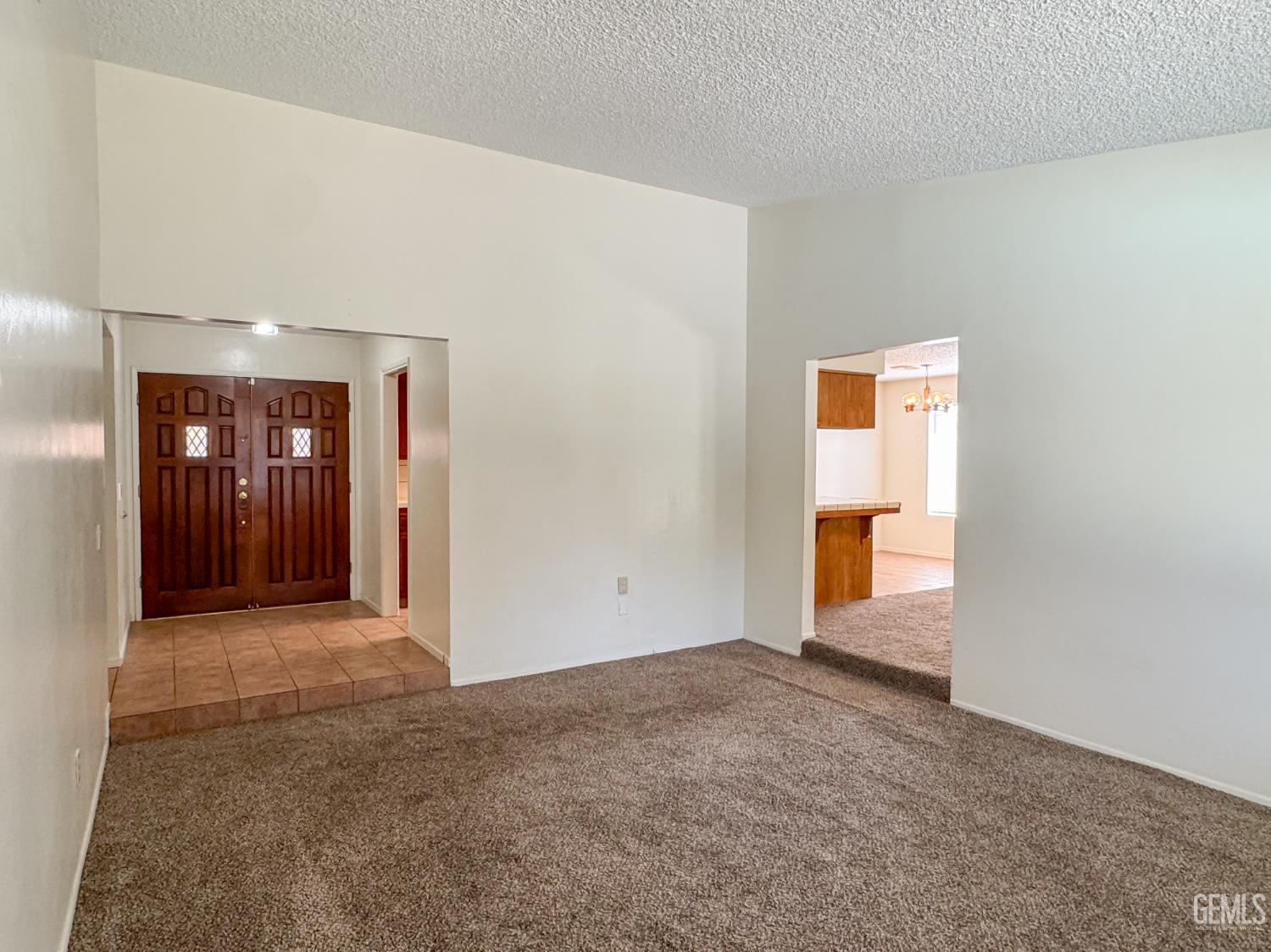 Undisclosed Address Bakersfield, CA 93309 - Photo 6 of 38 an empty room with entrance door
