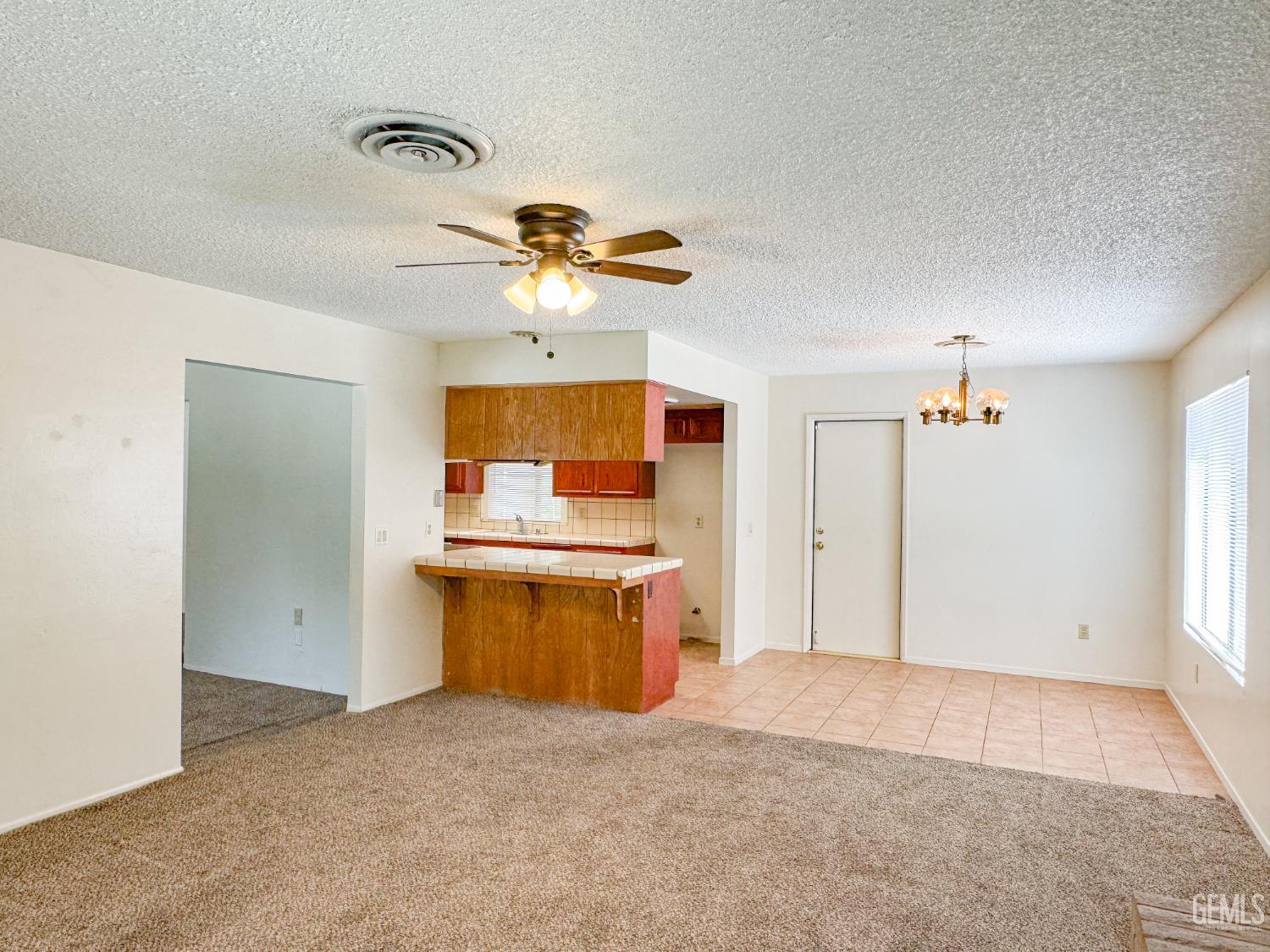 Undisclosed Address Bakersfield, CA 93309 - Photo 9 of 38 a view of a kitchen with a sink and a refrigerator