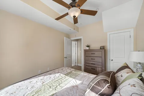 a bedroom with a bed and a dresser