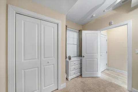 an empty room with closet area