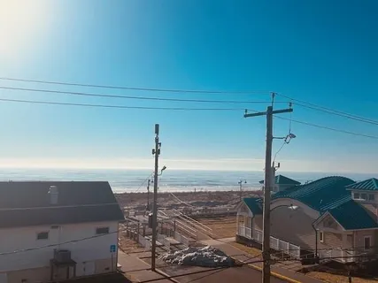 a view of a balcony with an ocean view